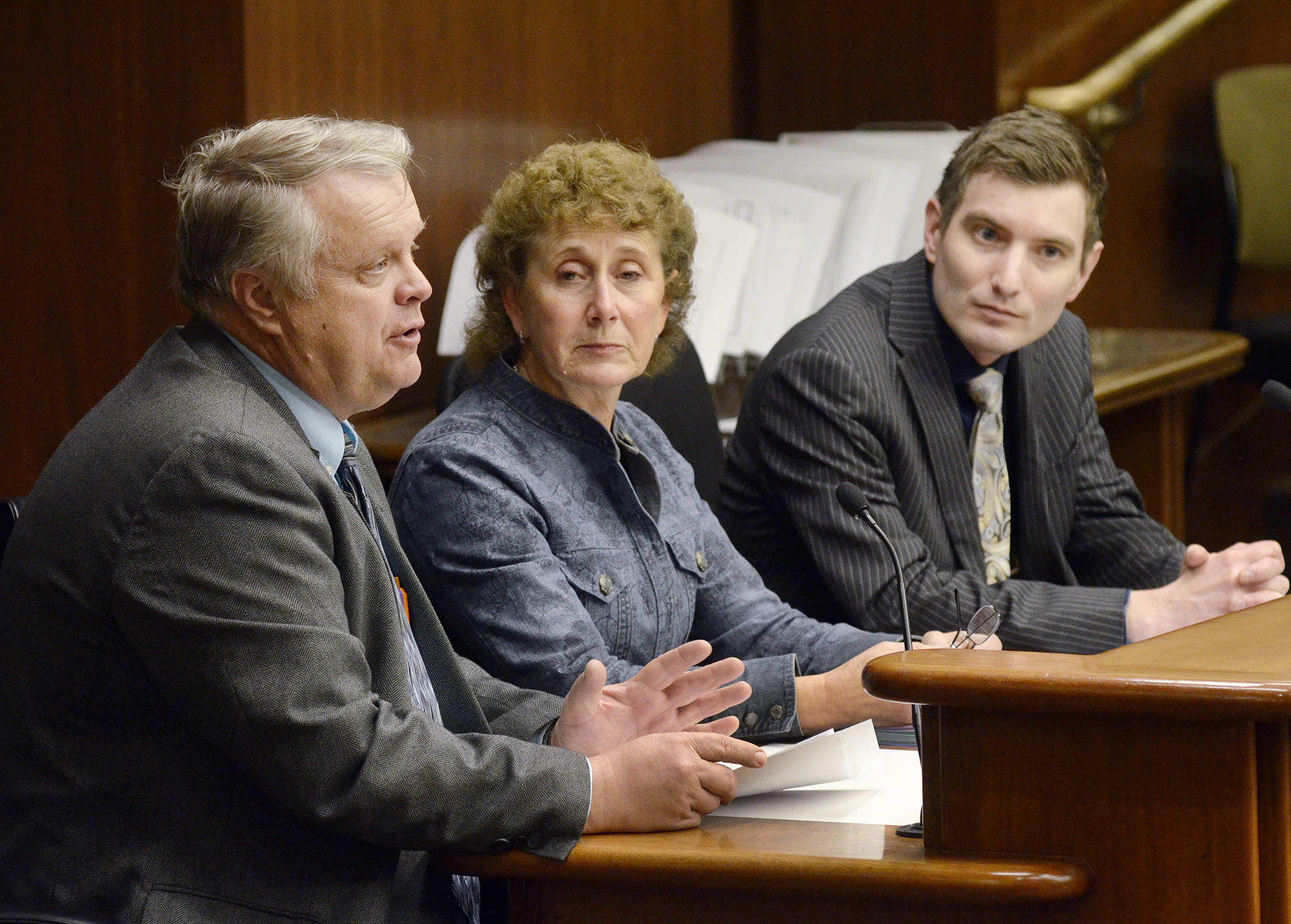 St. Louis County Commissioner Keith Nelson, left, and Arrowhead Regional Corrections Executive Director Kay Arola, center, testify for a bill sponsored by Rep. Jason Metsa, right, to establish a butcher training pilot program. Photo by Andrew VonBank